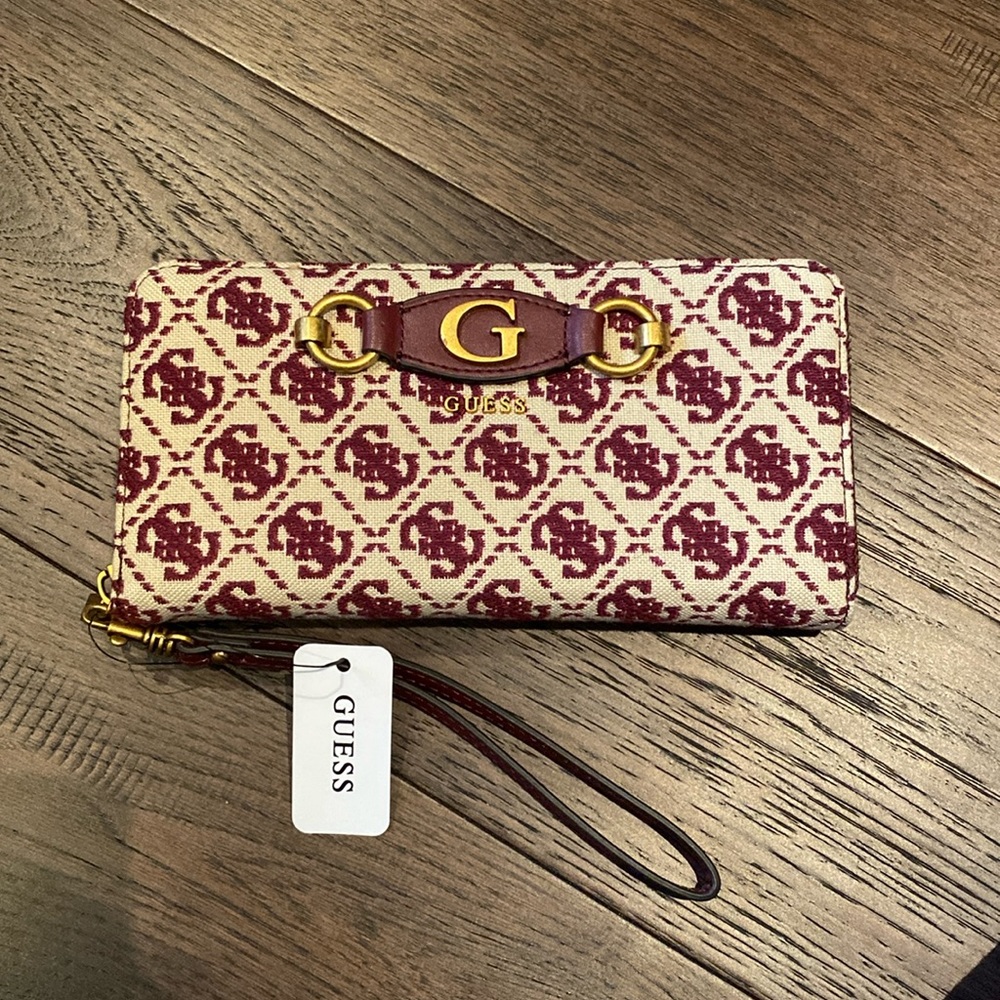 Brand new guess wallet. Colour is merlot and cream with brass hardware.